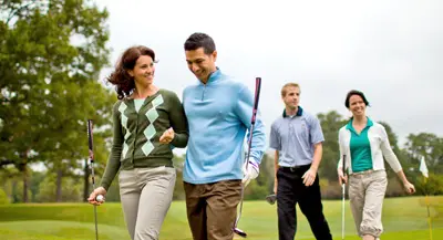 Photo of couples on the golf course